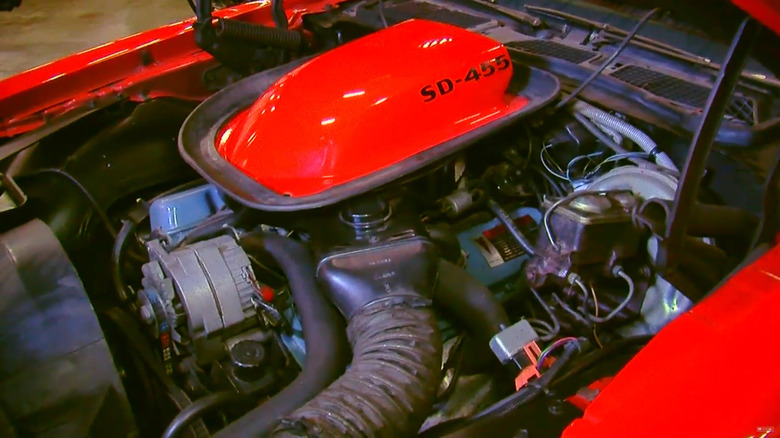 Under the hood of a red 1974 Pontiac Firebird Trans Am Super Duty 455