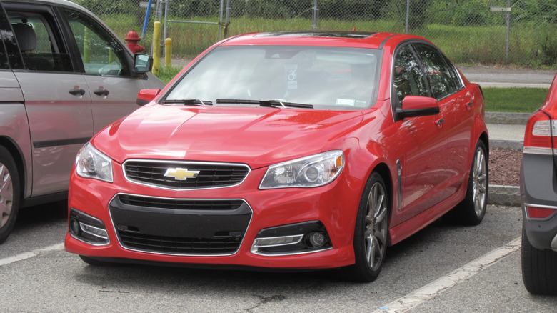 A red Chevrolet SS in a parking lot