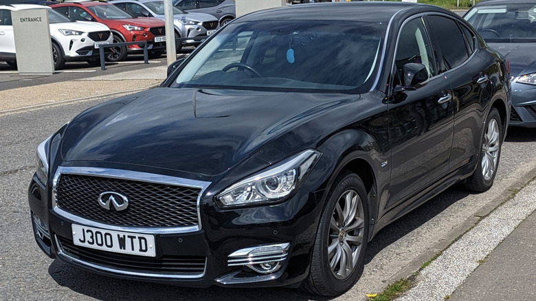 A black 2017 Infiniti Q70 in a dealership lot
