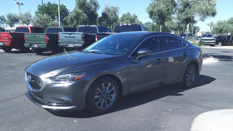 A gray 2018 Mazda6 Sport in a dealership lot