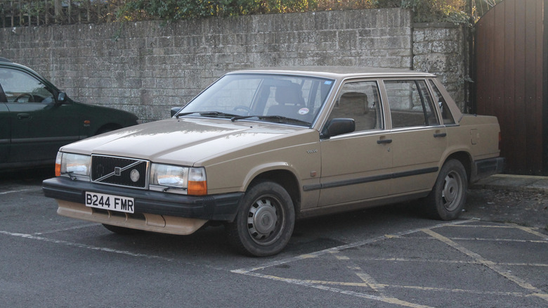 A beige 1985 Volvo 740 in a parking lot