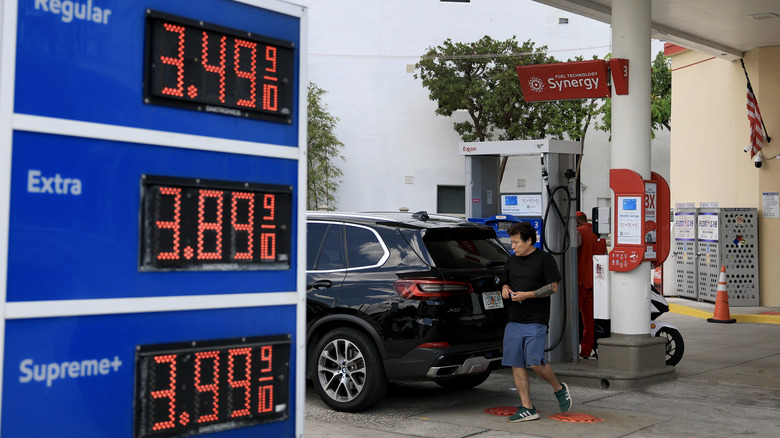 A customer gets fuel at an Exxon gas station on May 22, 2025 in Miami, Florida