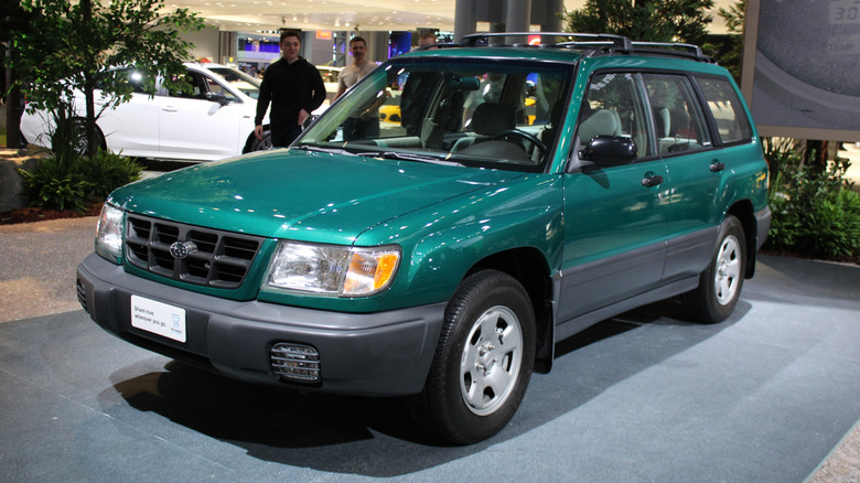 A Green Subaru Forester parked in a building
