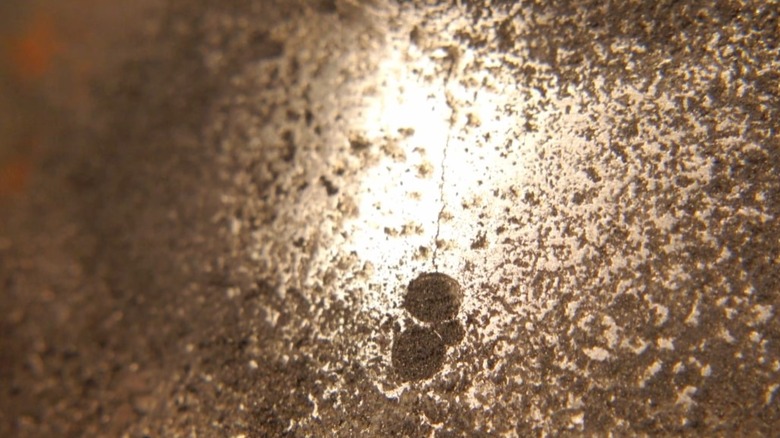 Close up shot of an engine block with a crack