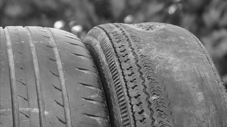 Side-by-side comparison of an evenly worn tire versus one with cupping and edge wear.