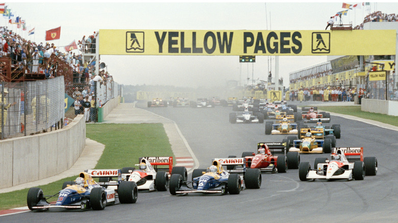 Nigel Mansell, driver of the #5 Canon Williams Renault Williams FW14B Renault 3.5 V10 leads the field at the start of the Yellow Pages South African Grand Prix on 1st March 1992 at the Kyalami Grand Prix Circuit in Kyalami, South Africa.