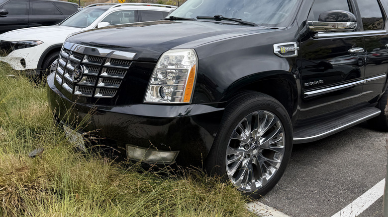 Front end of a black Cadillac Escalade hybrid