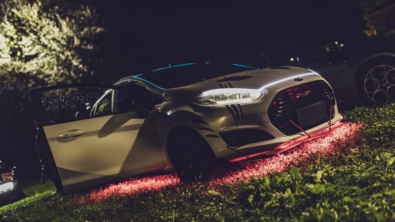 Modded Ford Fiesta with red underglow lights