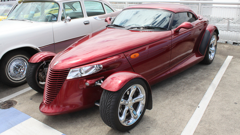 A red Chrysler Prowler at a car show