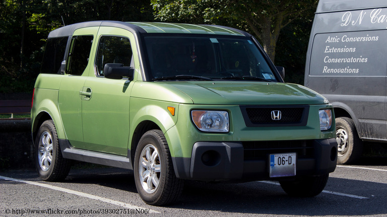 A green 2006 Honda Element in a parking lot