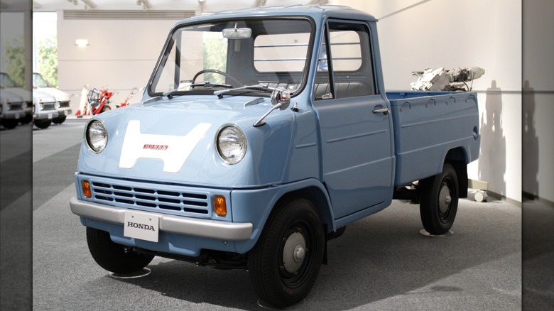 Light blue Honda T60 truck seen in left front three-quarter vie on display in Honda Collection Hall