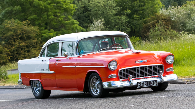 This is a 1955 Chevrolet Bel Air out for a drive on a warm day..