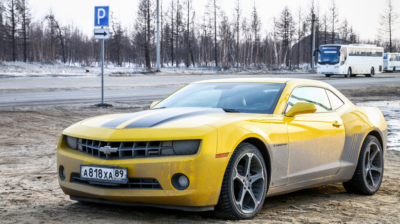 Novyy Urengoy, Russia - May 19, 2018: Dirty muscle car Chevrolet Camaro in the city street.