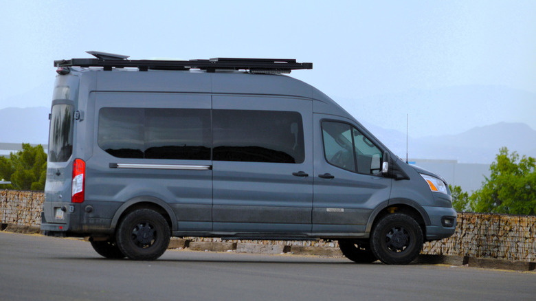 Phoenix, AZ — August 25, 2025:A Solar Equipped Ford Transit Camper Parked in a rural Setting, Embracing Modern Van Life.  by: Around the World Photos