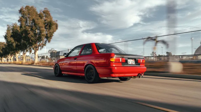 A rear three-quarters view of a red 1991 Sentra SE-R