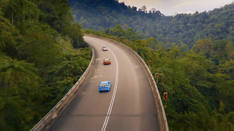 Screengrab from The Grand Tour of three cheap sports cars driving through Malaysia.