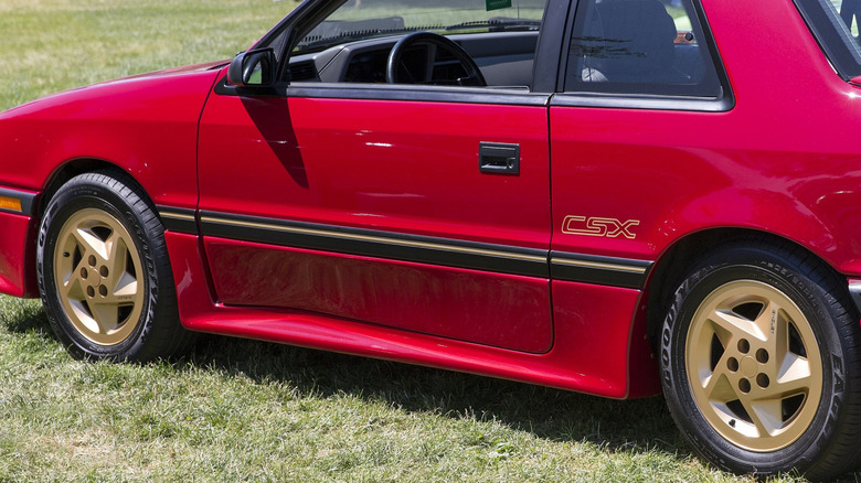 A closer look at the gold plastic wheels of a 1989 Shelby CSX VNT at the 2024 Greenwich Concours d'Elegance.