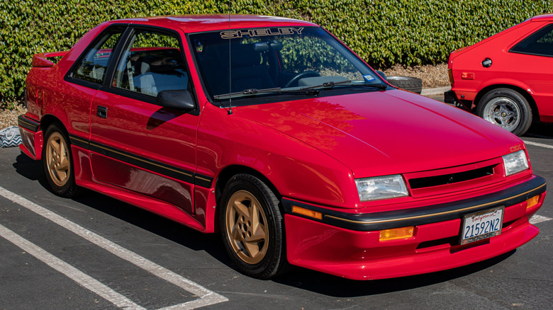A front-right view of the red 1989 Dodge Shelby CSX-VNT