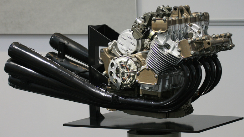 A Honda RC165 250cc 6-cylinder engine on a stand