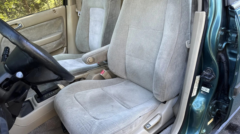 A look at the tan fabric front seats in the million-mile Accord showing minimal wear