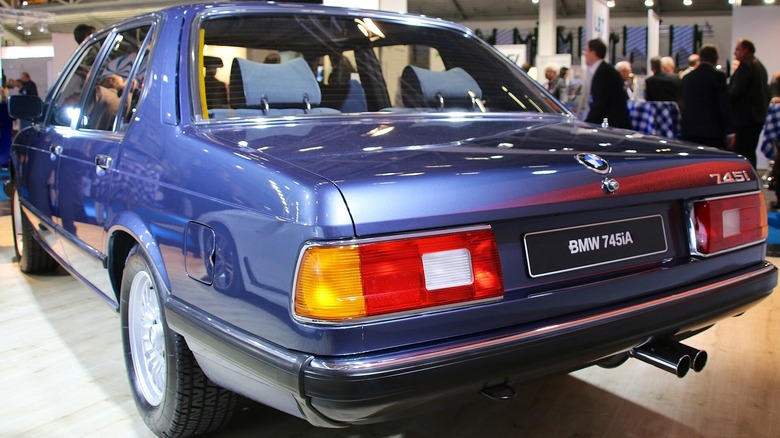 A blue, 1980-1986 era BMW 745i turbo sedan.