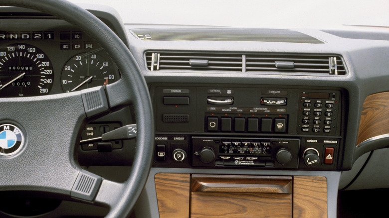 The interior of an E23 BMW 745i, featuring its onboard computer and air condition controls.