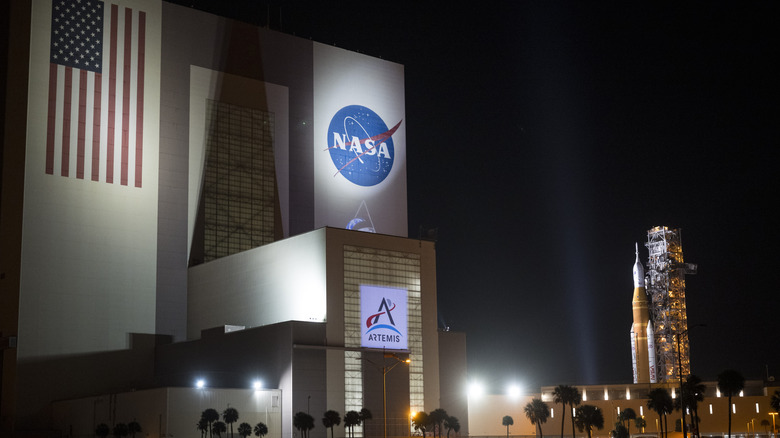 The NASA Vehicle Assembly Building with the Artemis II Orion rocket in the background