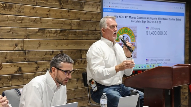 Scene from 2026 auction of 48-inch Musgo Gasoline Sign at Richmond Auctions.