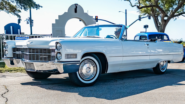 A 1966 Cadillac DeVille convertible parked in the sun.