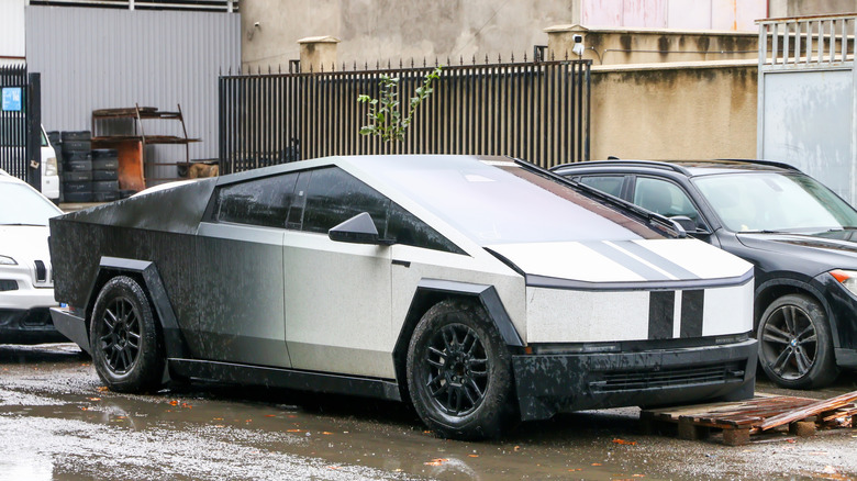 A Tesla Cybertruck with a custom stripe on the hood.