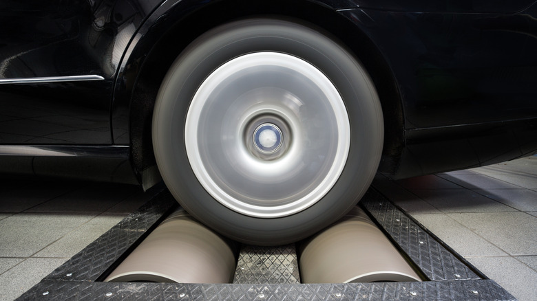 Car wheel turning on a dynamometer