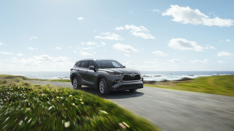 2026 Toyota Highlander driving on coast road