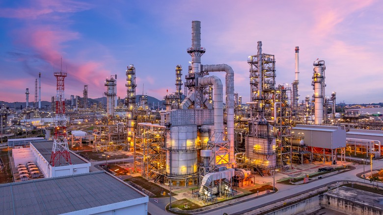 An oil refinery at dusk