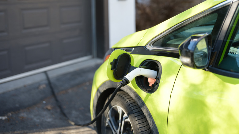 Charging a Chevrolet Bolt in a driveway