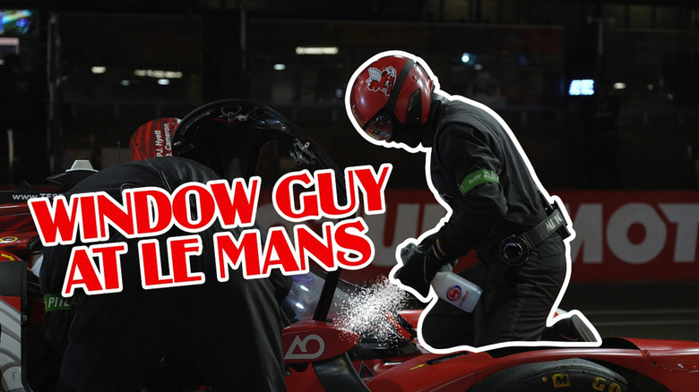 AO Racing's "Window Guy" is on the top of AO Racing's "Rocky" car at Le Mans, spraying the windows. His body/form is outlined by a white line. Text reads "Window guy at Le Mans."
