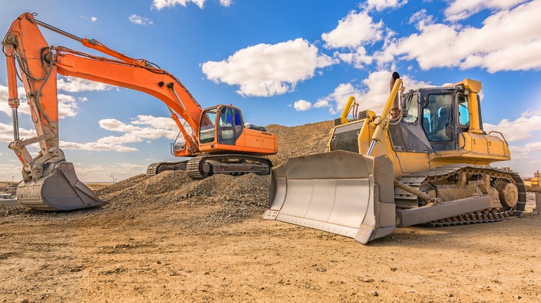 Excavator and bulldozer used in road construction