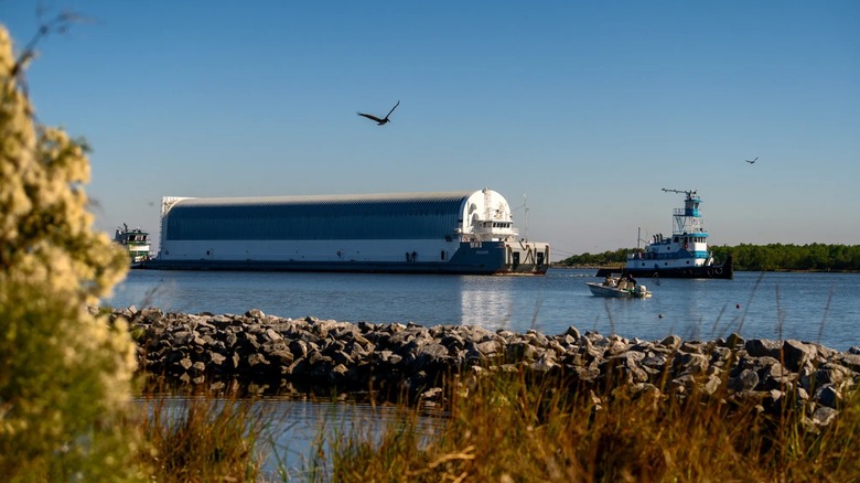 A side view of the NASA Pegasus barge as it cruises on the water