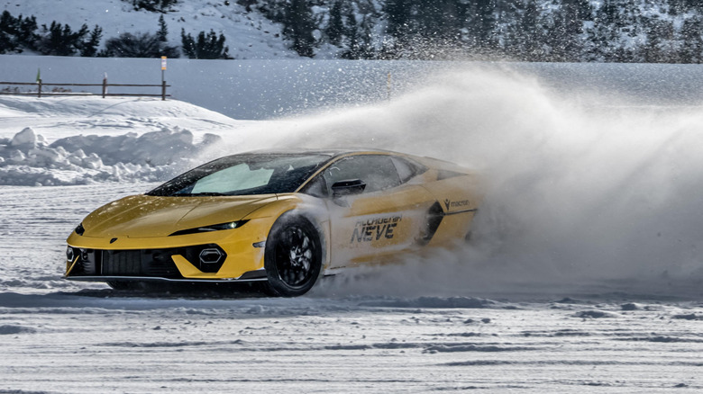 A yellow Lamborghini Temerario drifting in the snow