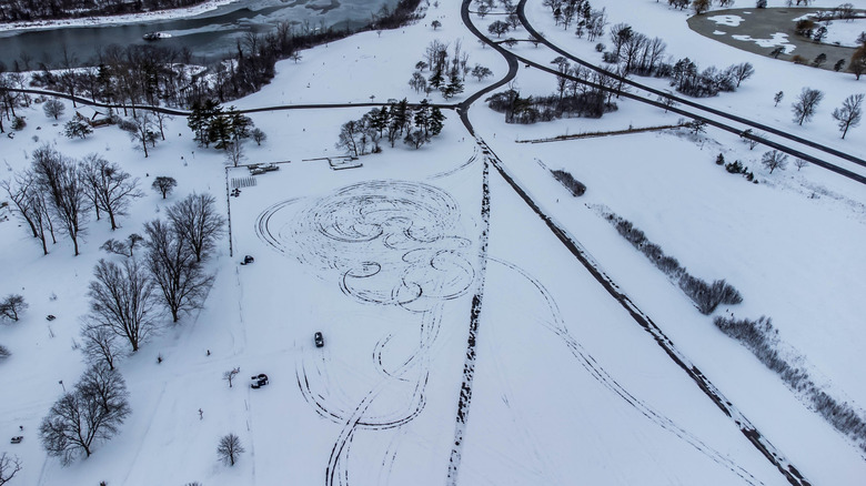 Donut marks in a snowy parking lot