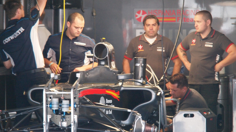 HRT engineers in their pit box in 2010.