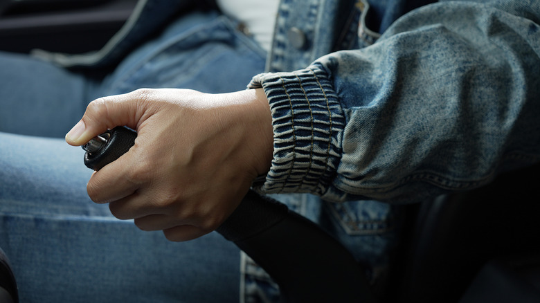 Person applying the handbrake