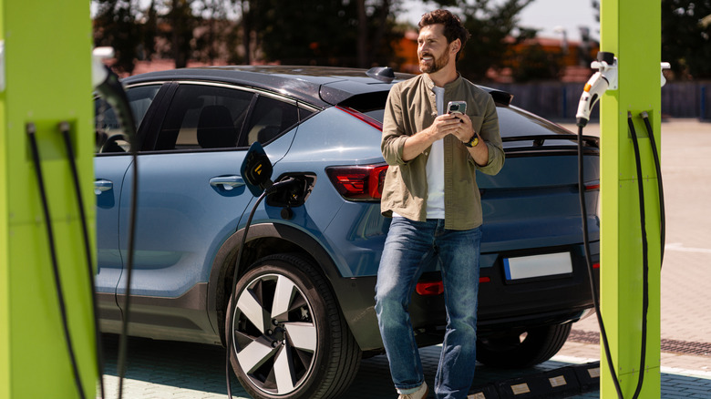 A man standing in front of a Volvo C40