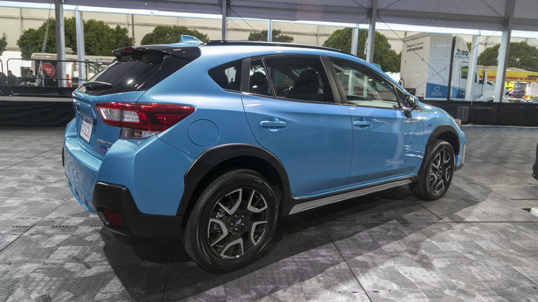 A blue Subaru Crosstrekon the floor of the New york Auto show in 2019