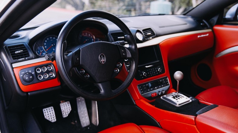 The interior of a 2009 Maserati Gran Turismo S with a manual transmission swap.