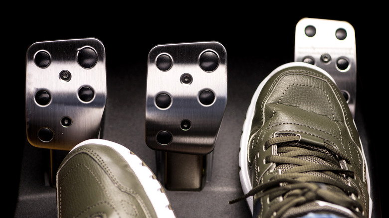 A driver's correct ft pressing nan accelerator pedal of a manual car