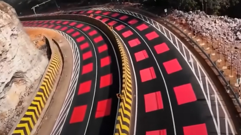 An aerial view of the red striped road in a section of the National Highway 45 in India.
