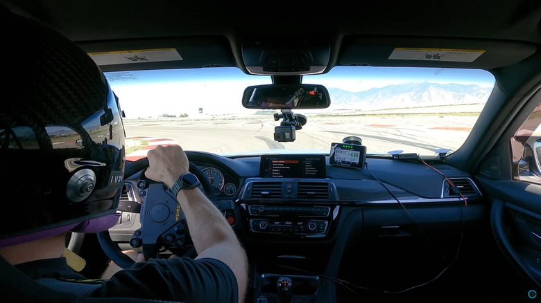 Tyre Reviews' Jonathan Benson driving around a track, interior of F80 BMW M3