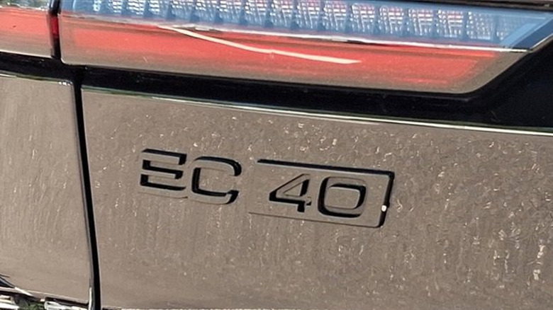 A close-up of the black EC40 badge on the tailgate of the car with a bit of the rear tail light at the top