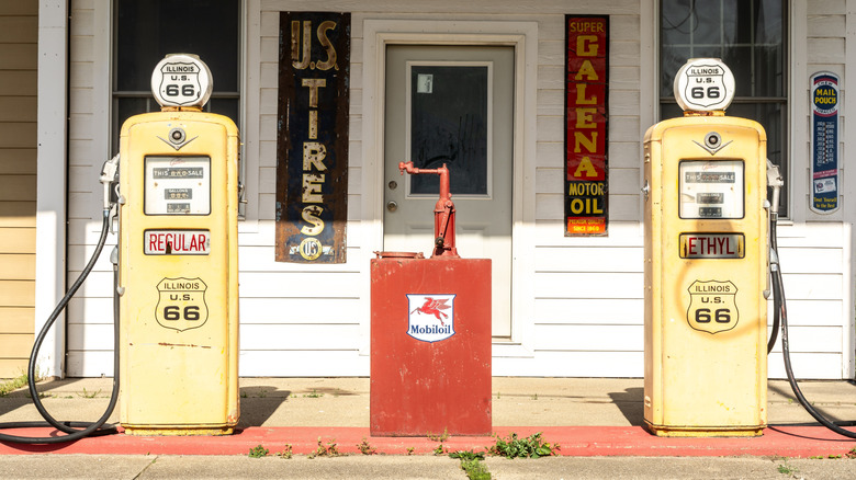 A vintage gas station with two fuel dispensers