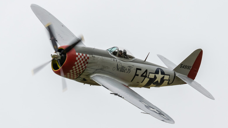 A P-47 Thunderbolt World War II airplane flying astatine an aerial show